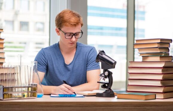 Student studying Cambridge IGCSE combined science
